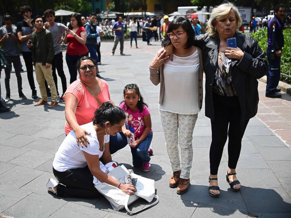 PHOTO: People react as a 7.1 magnitude earthquake rattles Mexico City on September 19, 2017. An earthquake drill was being held in the capital at the time that todays quake struck.