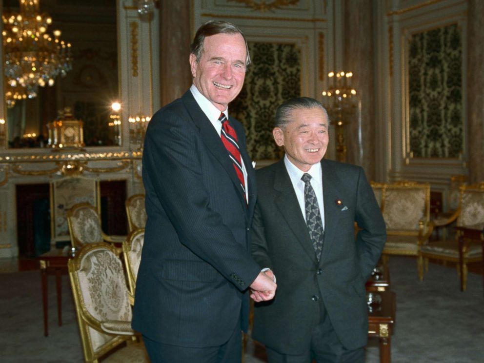 PHOTO: President George H.W. Bush is greeted by Japanese Prime Minister Noboru Takeshita, Feb. 23, 1989, after Bush arrived for tomorrows funeral of Emperor Hirohito.