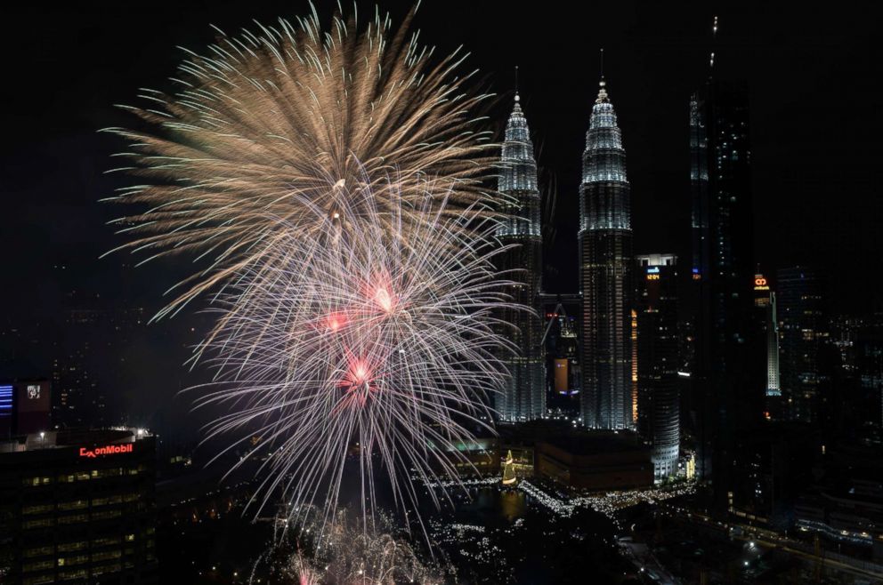 PHOTO: Fireworks illuminate the sky near Malaysias Petronas Twin Towers during New Year celebrations in Kuala Lumpur, Jan. 1, 2018. 