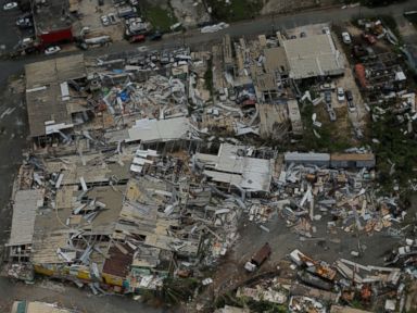 PHOTO: Aluminum roofing is seen twisted and thrown off buildings as recovery efforts continue following Hurricane Maria near San Jose, Puerto Rico, Oct. 7, 2017.