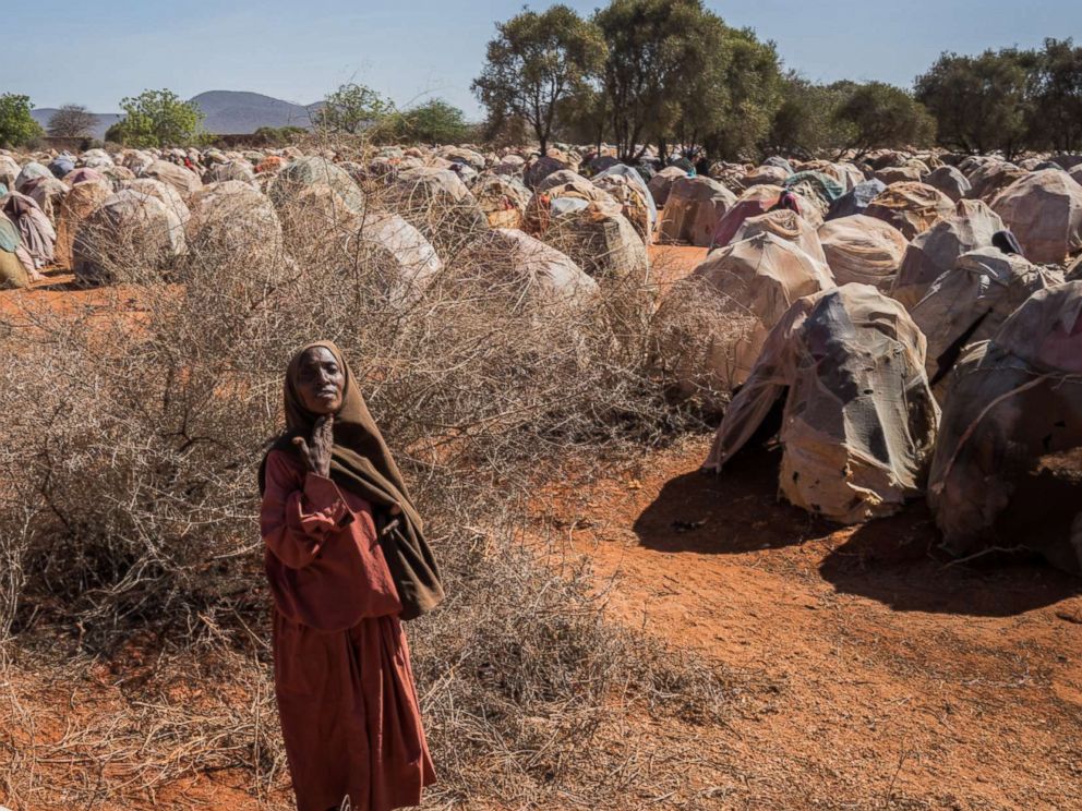 PHOTO: An elderly woman begs for food at a camp for the internally displaced on the outskirts of Dinsor, Somalia, March 8, 2017. The country is on the brink of a famine, just six years after another famine led to the loss of a quarter of a million lives.