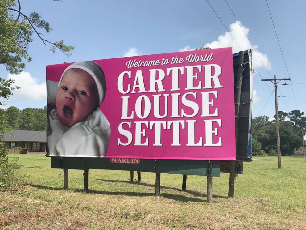 PHOTO: Kelen and Will Settle were surprised when his coworkers put up a giant billboard announcing their daughters birth along a South Carolina highway.