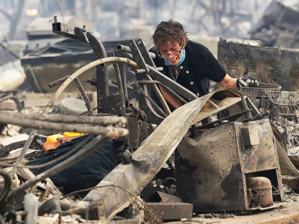 PHOTO: Kris Pond reacts as she searches the remains of her familys home destroyed by fires in Santa Rosa, Calif., Oct. 9, 2017.