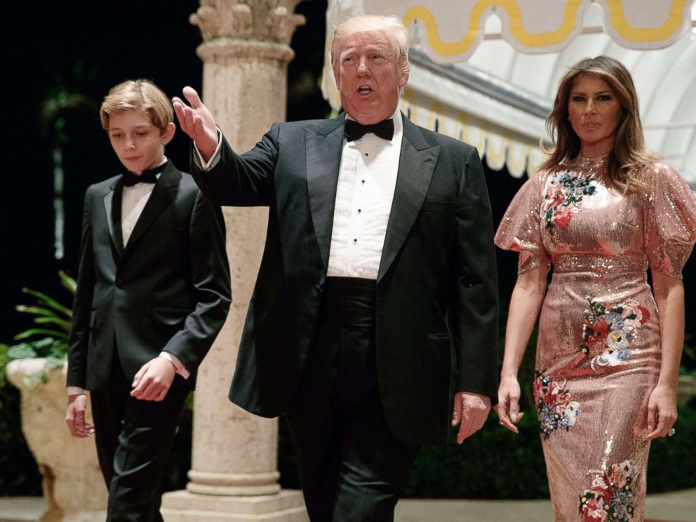 PHOTO: President Donald Trump, first Mrs. Melania Trump and her son Barron arrive at a New Year's Eve gala at their resort Mar-a-Lago , on December 31, 2017, in Palm Beach, Florida.
