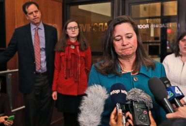 PHOTO: Democratic candidate Shelly Simonds talks to the press when her husband, Paul Danehy, left, and his daughter, Georgia Danehy, listen after a drawing to determine the winner of an election tied at the Capitol in Richmond , Goes. January 4, 2018.