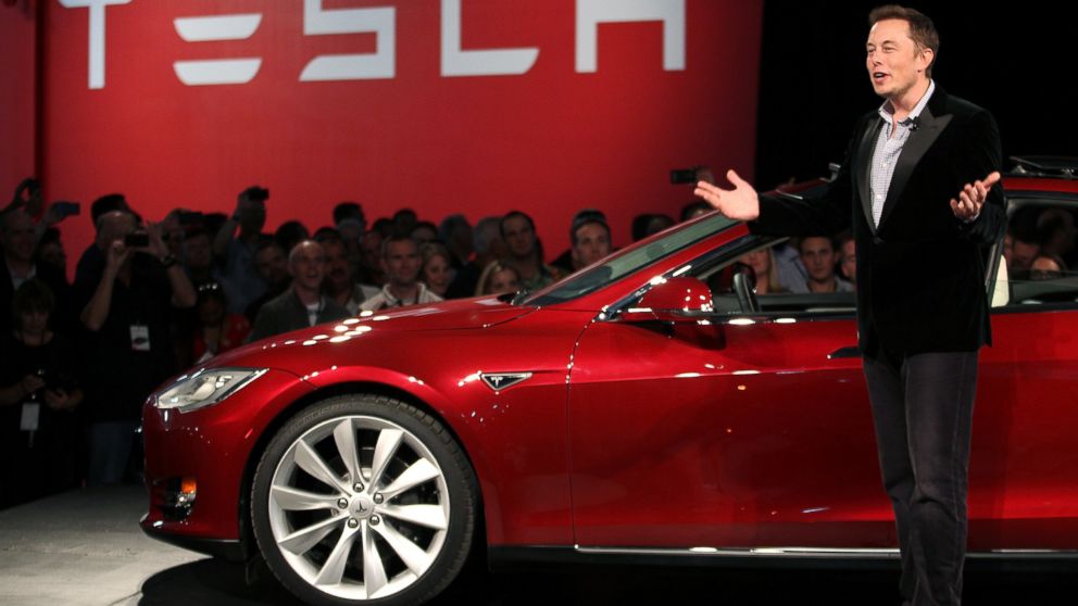 PHOTO: Tesla Motors CEO Elon Musk speaks next to the companys then newest Model S during the Model S Beta Event held at the Tesla factory in Fremont, Calif., Oct. 1, 2011.