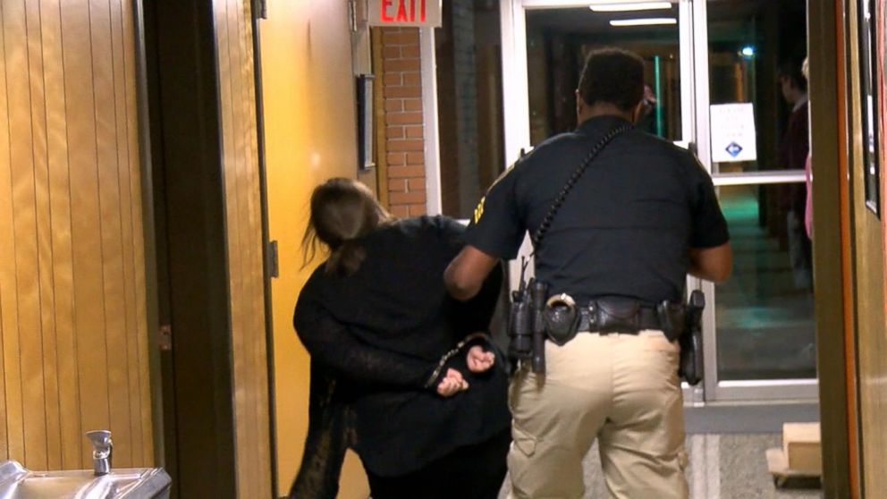 Teacher handcuffed after being removed from school board meeting Video ...