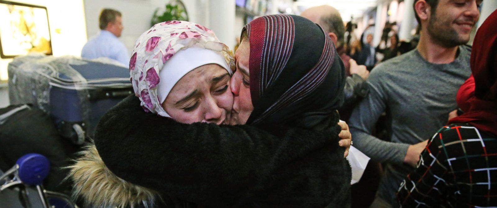 PHOTO: Baraa Haj Khalaf, left, gets a kiss from her mother, Fattuom Bakir, after arriving at OHare International Airport, in Chicago, on Feb. 7, 2017. 