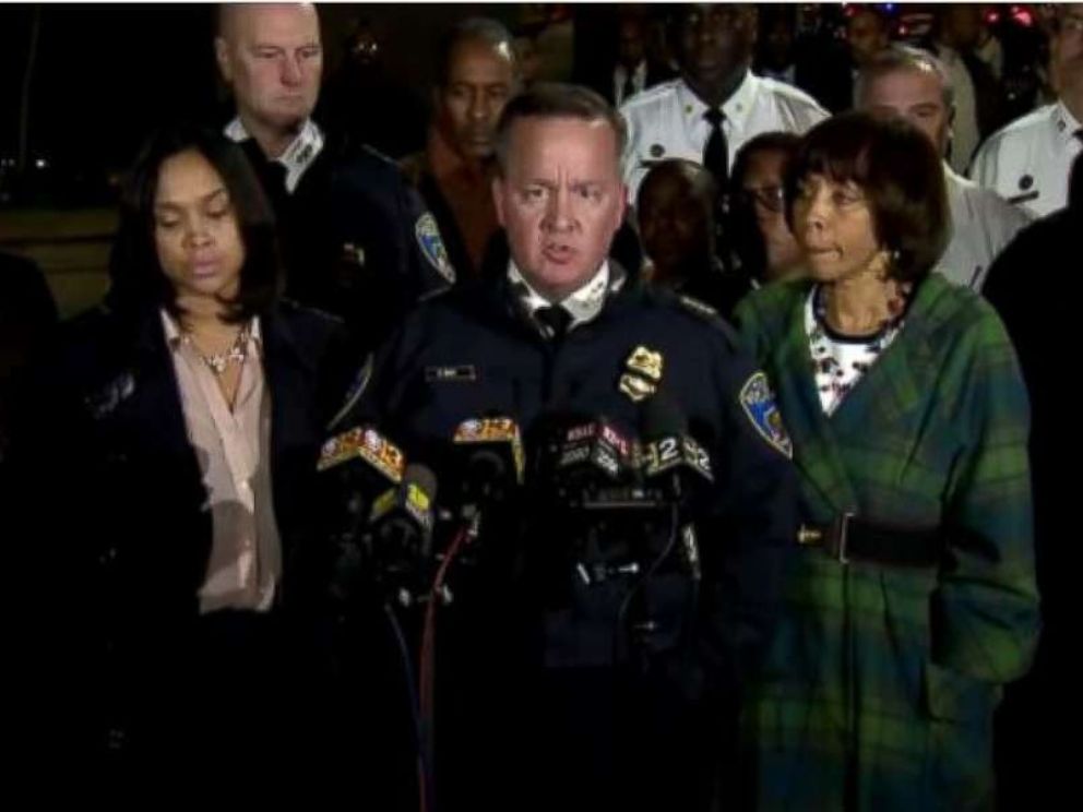 Baltimore Police Commissioner Kevin Davis, center, speaks at a press briefing on Wednesday evening. 