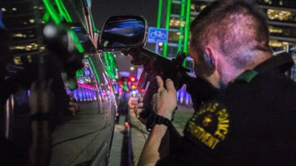 Dallas Police Officer Protects Local Photographer During Protest Shooting
