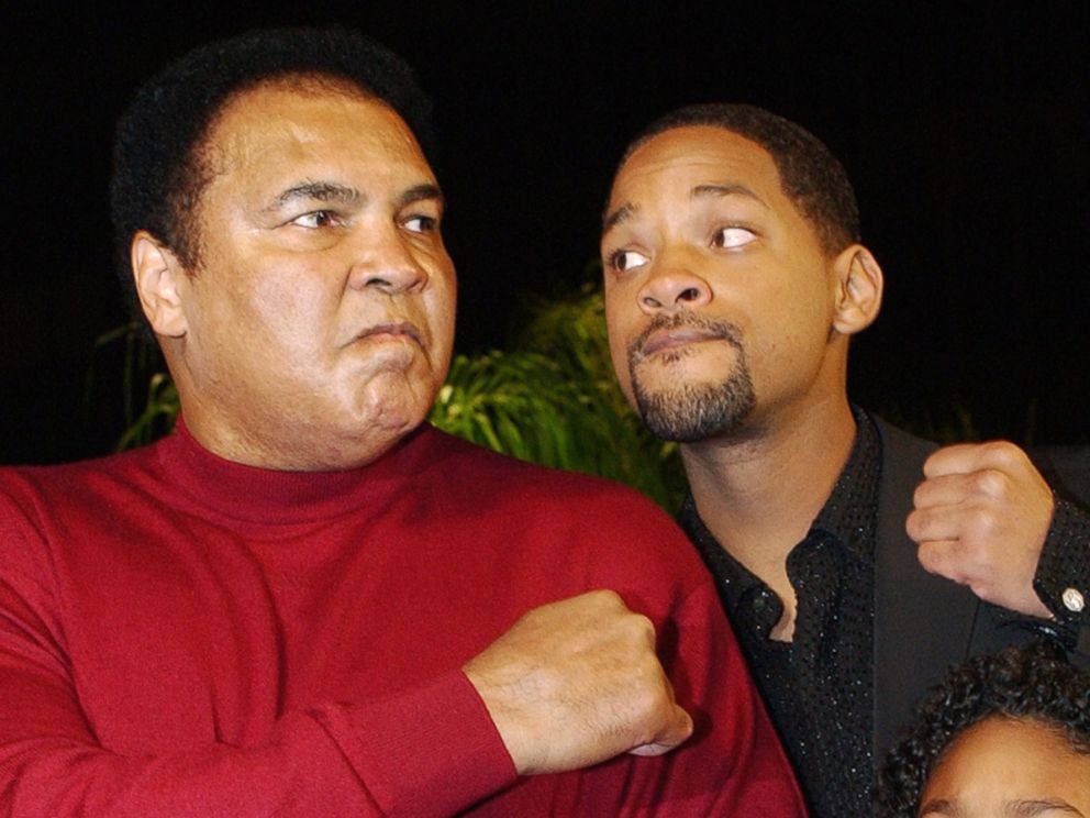 PHOTO: Muhammad Ali and Will Smith pose at the premiere of the film Ali, in Los Angeles, Dec. 12, 2001.