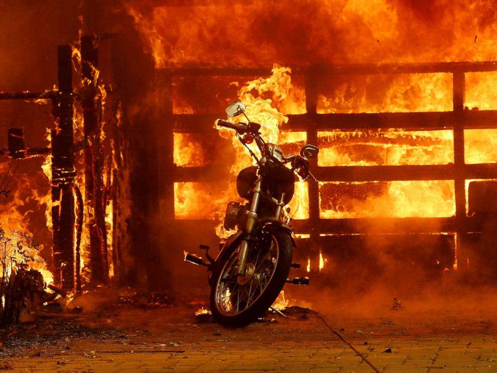 PHOTO: A motorcycle burns in the driveway of a home on fire in Glen Ellen, Calif., Oct. 9, 2017.