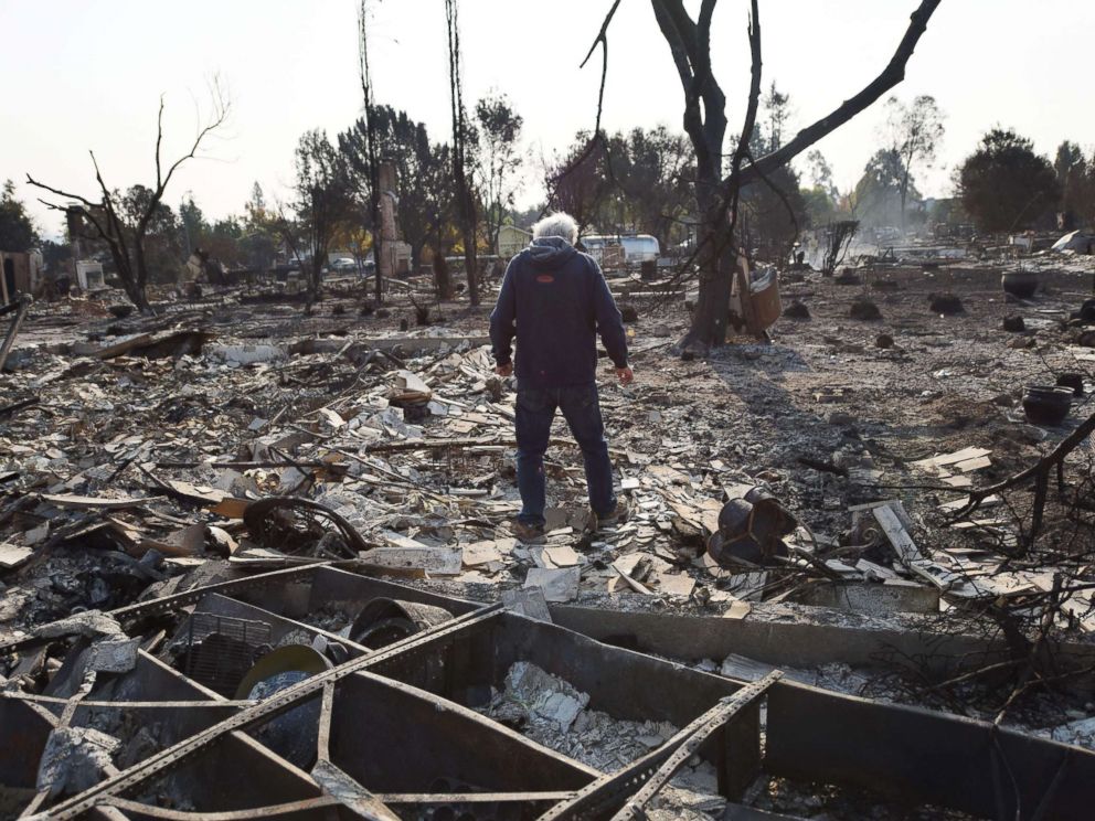 PHOTO: Homeowner Phil Rush looks at the remains of his home destroyed by wildfire in Santa Rosa, Calif., Oct. 11, 2017.