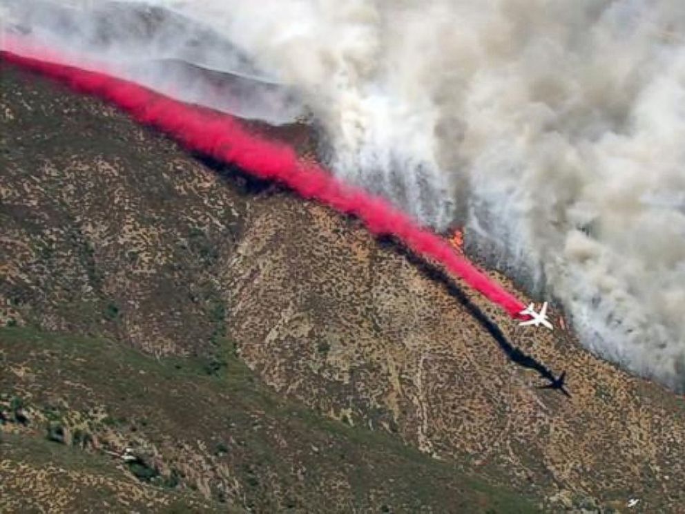 PHOTO: A plane drops fire retardant while battling the Blue Cut Fire in the San Bernardino National Forest on Tuesday, Aug. 16, 2016.