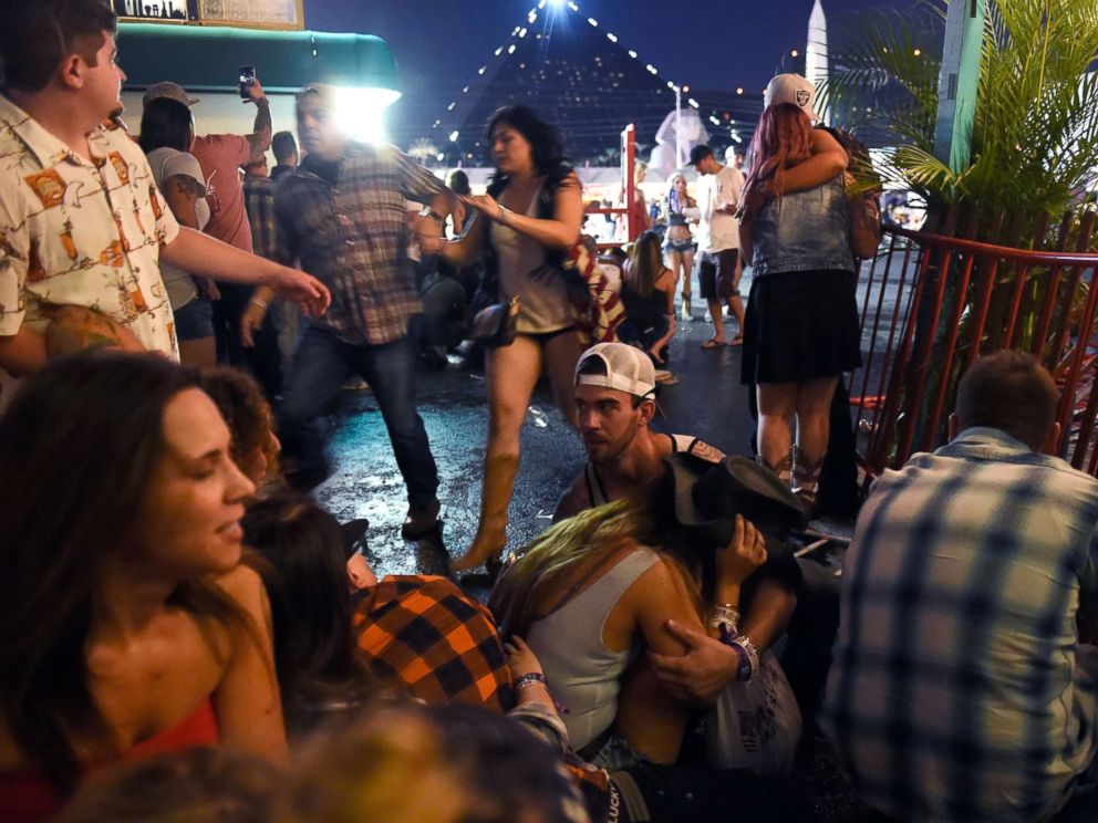 PHOTO: People run for cover at the Route 91 Harvest country music festival after gun fire was heard, Oct. 1, 2017 in Las Vegas. 