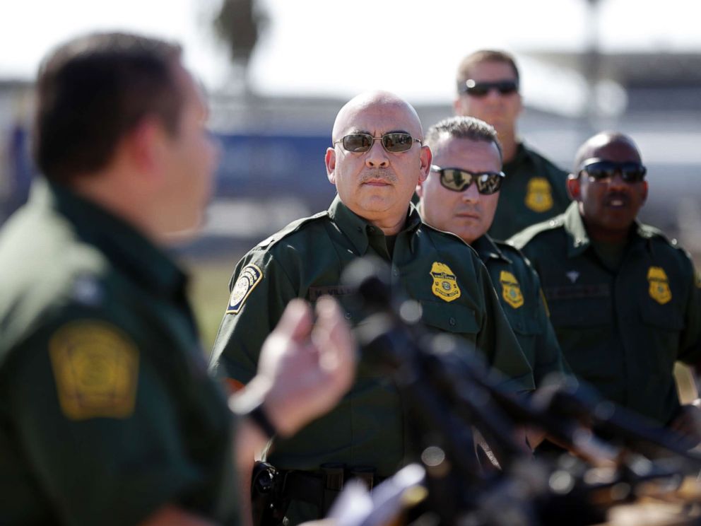 PHOTO: Roy Villarreal, Border Patrol Chief Patrol Agent, San Diego Sector, on the left, talks to other Border Patrol agents in front of secondary fences along the border that separates San Diego from Tijuana , Mexico, September 26. 2017, in San Diego.